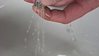 Urethral Sounding with a sprinkler end , pissing through it