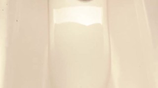 cumshot in public toilet