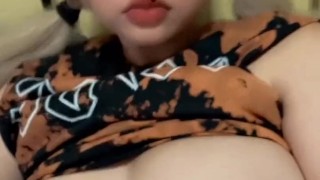 Blonde anime girl plays with her boobs
