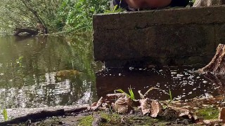 Stripping down naked inside a forest stroking my big skinny Cock at a lake and dipping my feet in