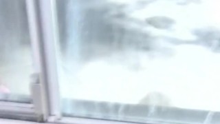 JO Infront of the window.