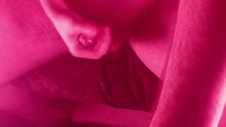 Masturbating with an overhead view with nice red lights