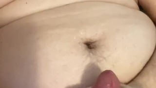 Chubby boy cums over fat tits