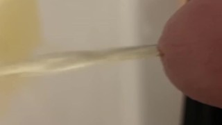 Daddy draining his cock of piss