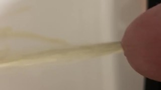 Daddy draining his cock of piss