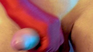 Man masturbates cock in red gloves