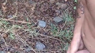I'm outside walking naked in the woods and masturbating