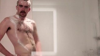 HAIRY OTTER JERKS OFF IN A HOTEL SHOWER