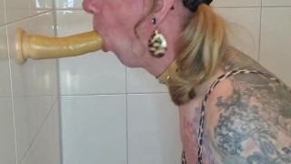Sissy sucks dildo