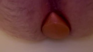 Beginning anal training with large plug.