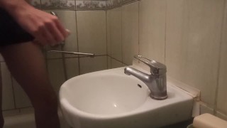 pissing my beautiful circumcised cock in the sink