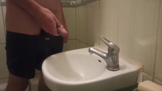 pissing my beautiful circumcised cock in the sink