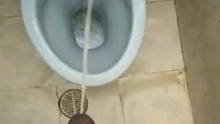 Pissing in Public Bathroom