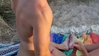 He puts sunscreen on me with four guys watching on the naked beach!