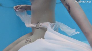 Finnish babe swims nude in the pool