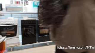 in a short skirt and stockings without underwear in the store
