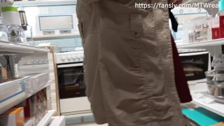 in a short skirt and stockings without underwear in the store