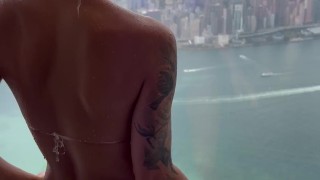 Monika Fox In Purple Bikini Swims In Pool & Poses By Window Against Background Of City