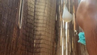 Hairy twink showering outdoors