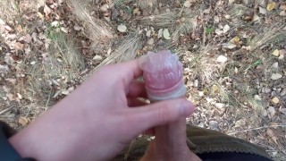 Young horny twink found a used condom in the woods, so he put his cock in it and spermed