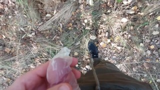 Young horny twink found a used condom in the woods, so he put his cock in it and spermed