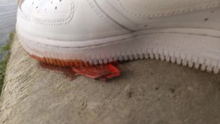 Boy crushes a ketchup packet with his new white sneakers Nike Air Force One AF1 sockless foot fetish