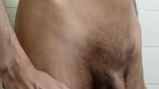 Young skinny man shows his body