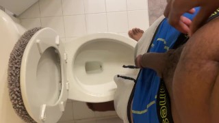 Young black dude pulls down underwear and pisses