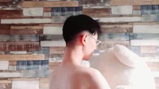 NAKE BOY DANCES WITH A BEAR