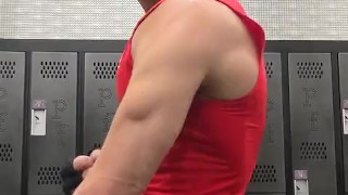 Jock shows off muscles and abs in locker room