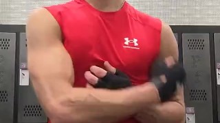 Jock shows off muscles and abs in locker room