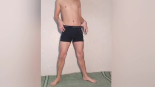 A young hot guy poses in underwear and takes off his black panties - boxers showing his dick and ass
