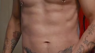 Tattooed guy uses dildo
