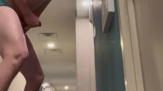 Twink playing in hotel hallway