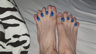 Skinny cute feet fingers stretched out bitten nails