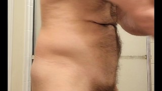 Hairy muscle bear flexing and stroking before shower