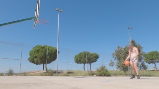 Sweaty basketball in tight singlet on public field
