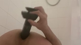 In A Chastity cage playing with toys