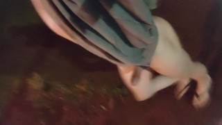 Femboy walks outdoors naked