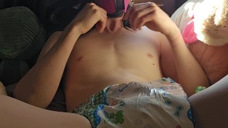 Puts clean diaper on