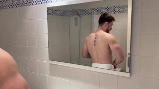 Muscular hairy jock ass exposed while stuck under the table