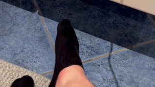Playing with my black socks in bathroom