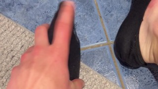 Playing with my black socks in bathroom
