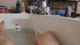 Guy gives himself a golden shower in the bathtub. Hot urine for hot daddy