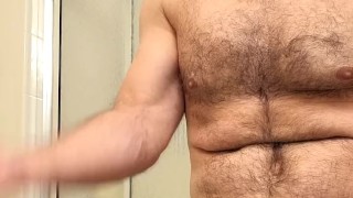 HAIRY MUSCLE BEAR FLEXING BEFORE HOT SHOWER!