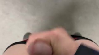 Twink jerks off in parking garage and blows load