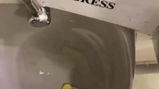 Destructive pissing in public urinal