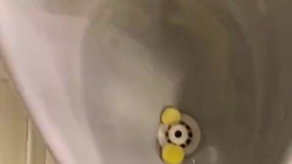 Destructive pissing in public urinal