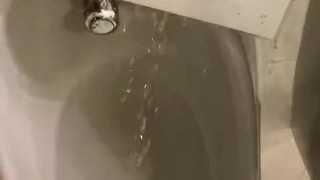 Destructive pissing in public urinal