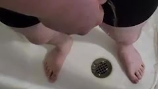 Playing with my piss while wearing underwear.